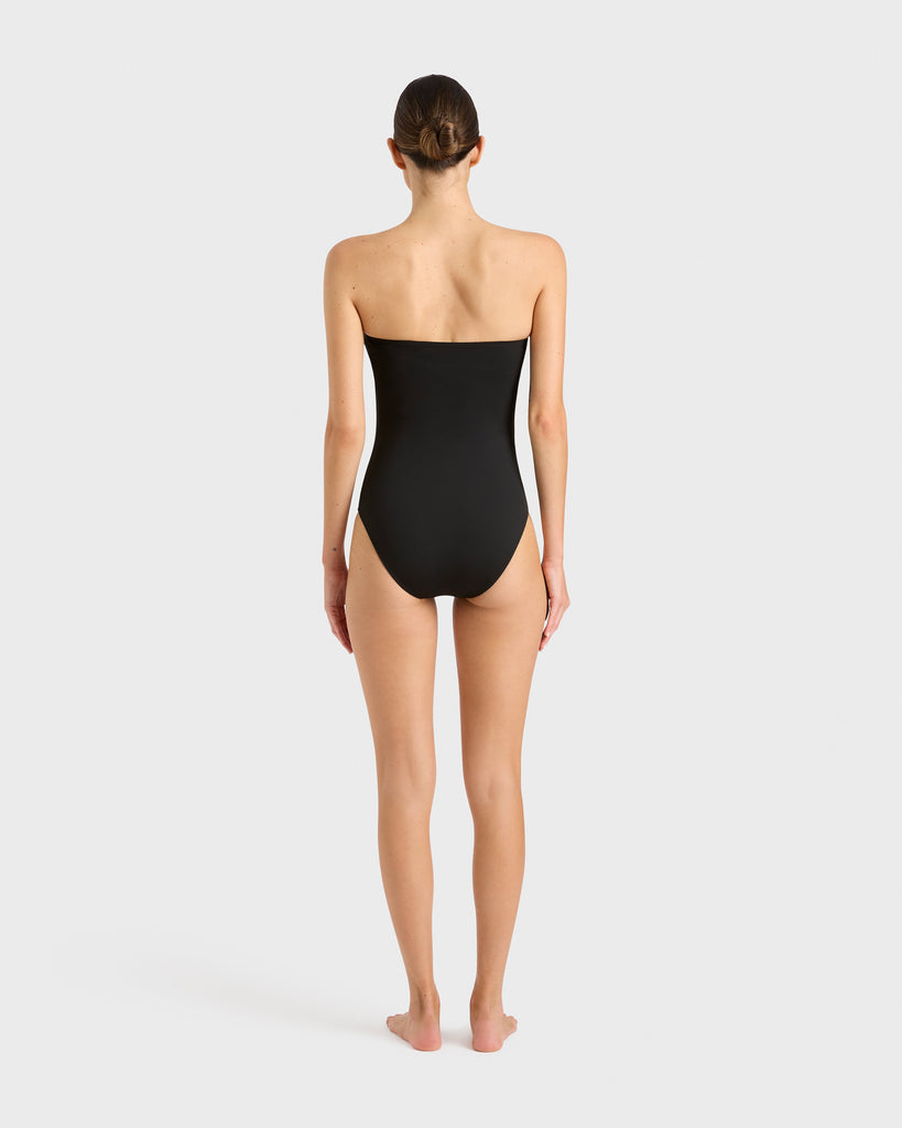 Back of BONDI BORN Alba Black swimsuit, modern asymmetrical style with confident coverage