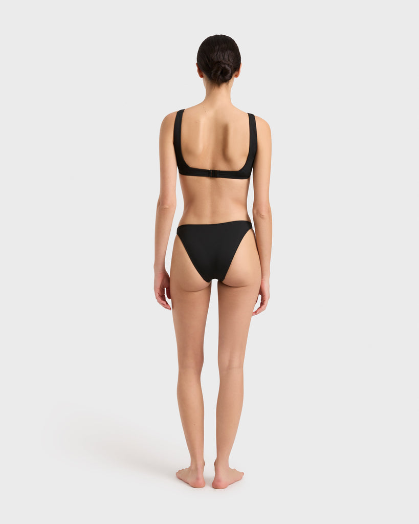 Black bikini bottom by BONDI BORN, flattering rear coverage with elevated simplicity